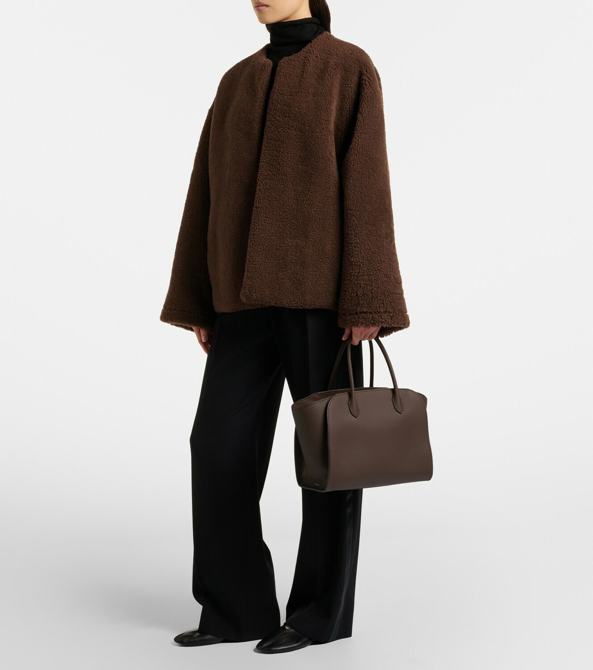 The Row neutral shirt and trouser outfit