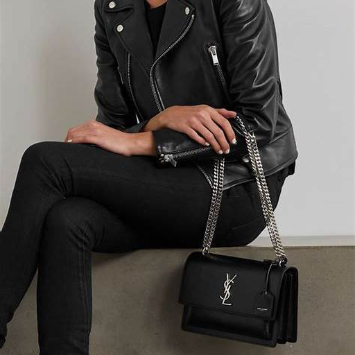 How to Style the Saint Laurent Sunset 22 in Crocodile-Embossed Leather with leather jacket and dark denim