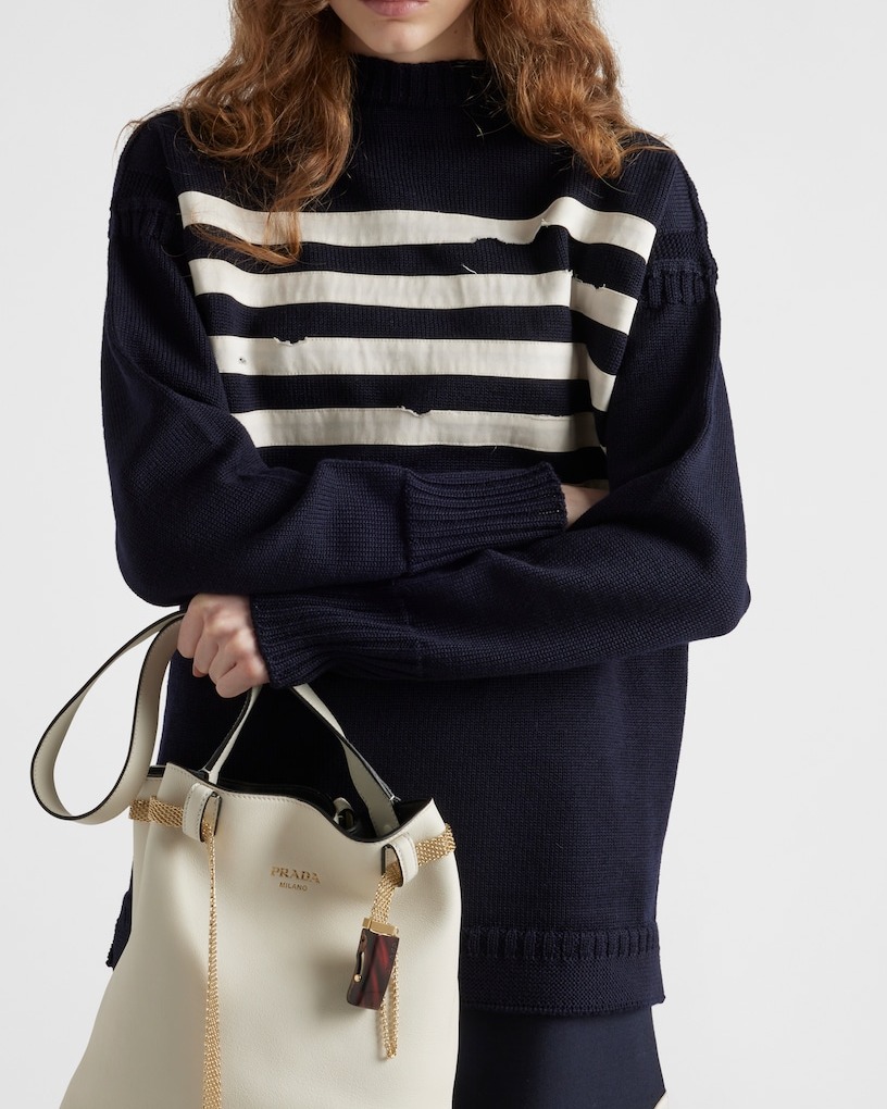 Prada Buckle leather bucket bag with jeweled belt model close view