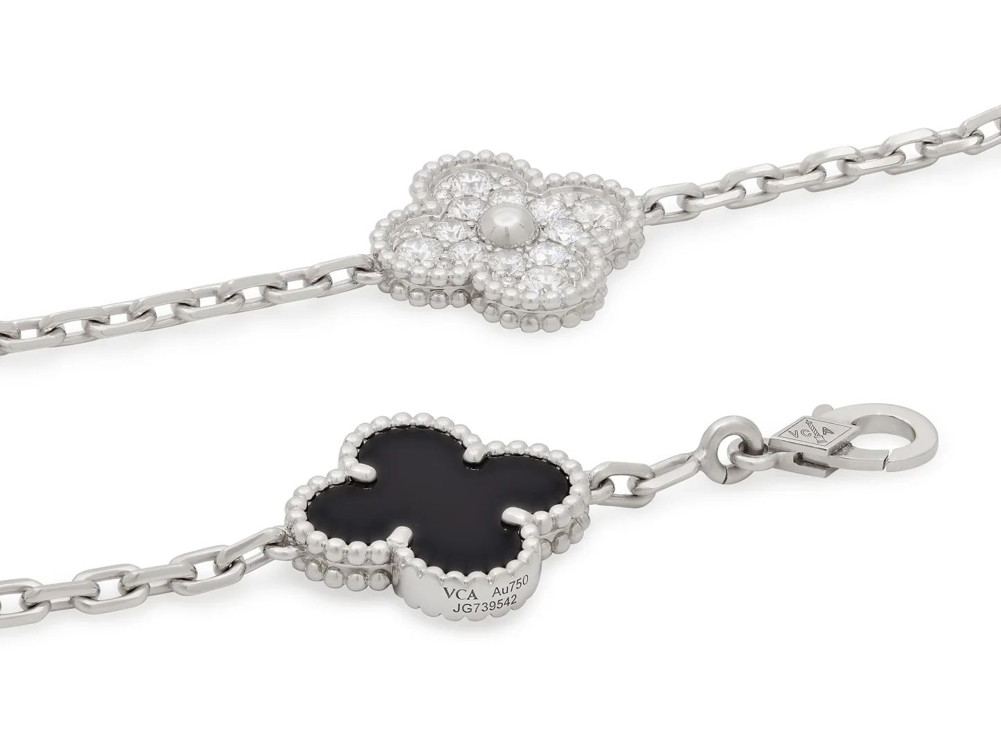 Real-life close product photo of Van Cleef & Arpels Vintage Alhambra bracelet showing diamond, onyx, white gold and signature details